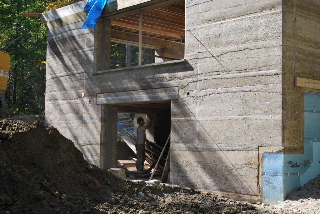 Rammed Earth House during Construction, showing Wall Layers, Photo by Susan Turner