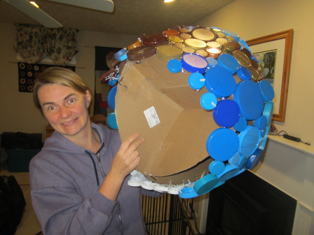 Plastic cap globe showing cardboard "ribs"