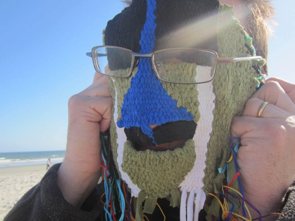 Bob tries on the mask at the beach