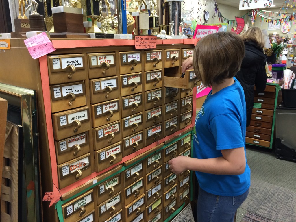 Nora explores the old card catalog drawers full of goodies