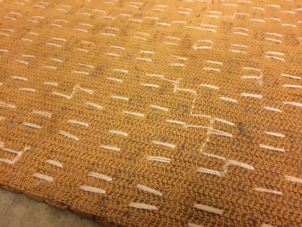 Stitching under the wine cork mat