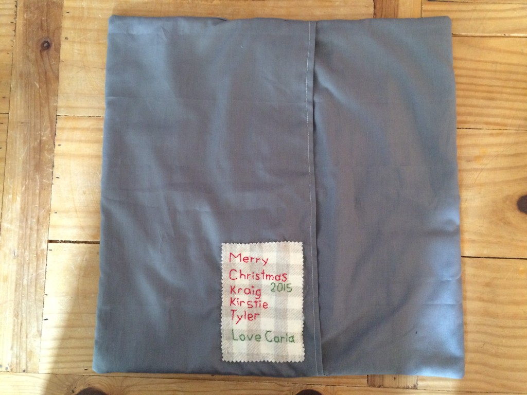 Back of the pillow, showing flap closure and label