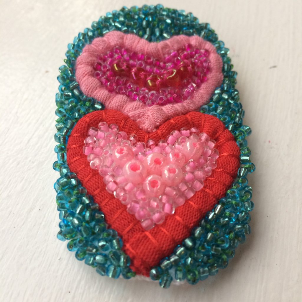 Valentine's broach made from recycled t-shirt yarn and beads
