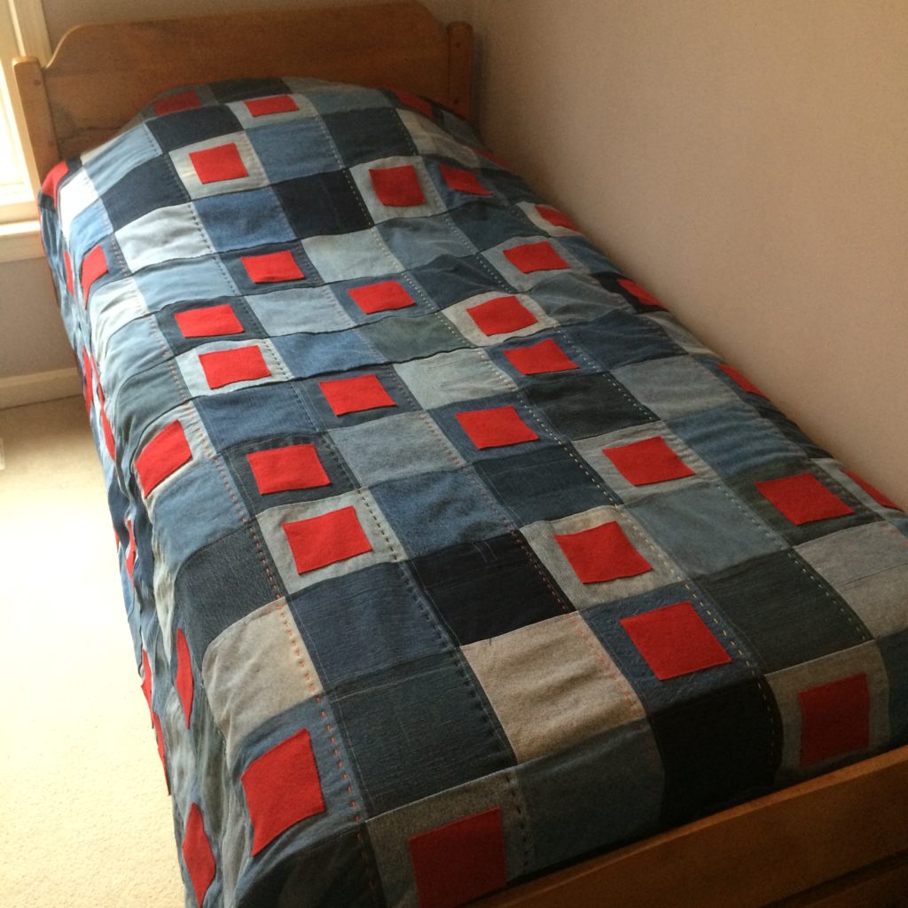 Weighted Blanket sewn by Trashmagination from recycled denim jeans and red wool coat