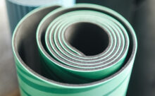 Rolled up green yoga mat