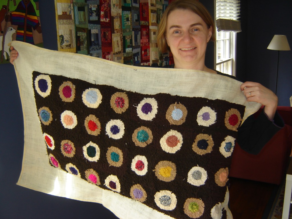 Carla Brown with hooked rug she made