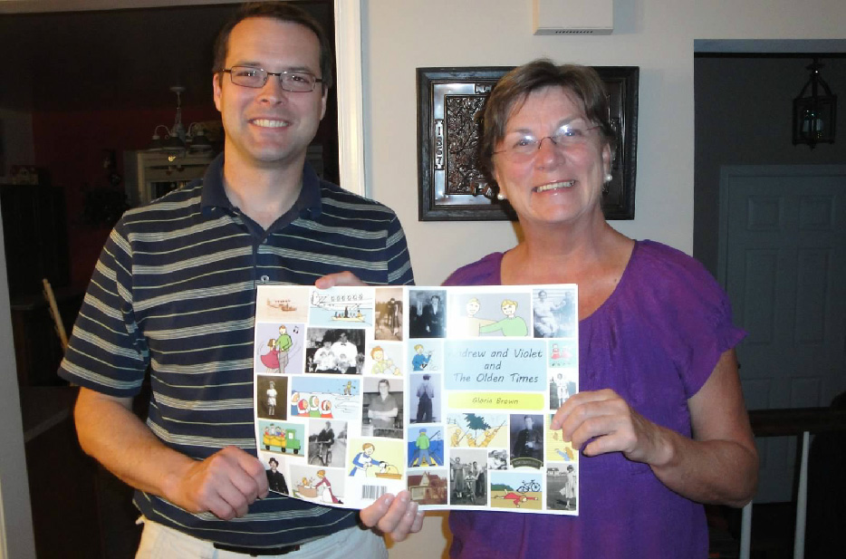 My husband and mom showing the finished family comic book