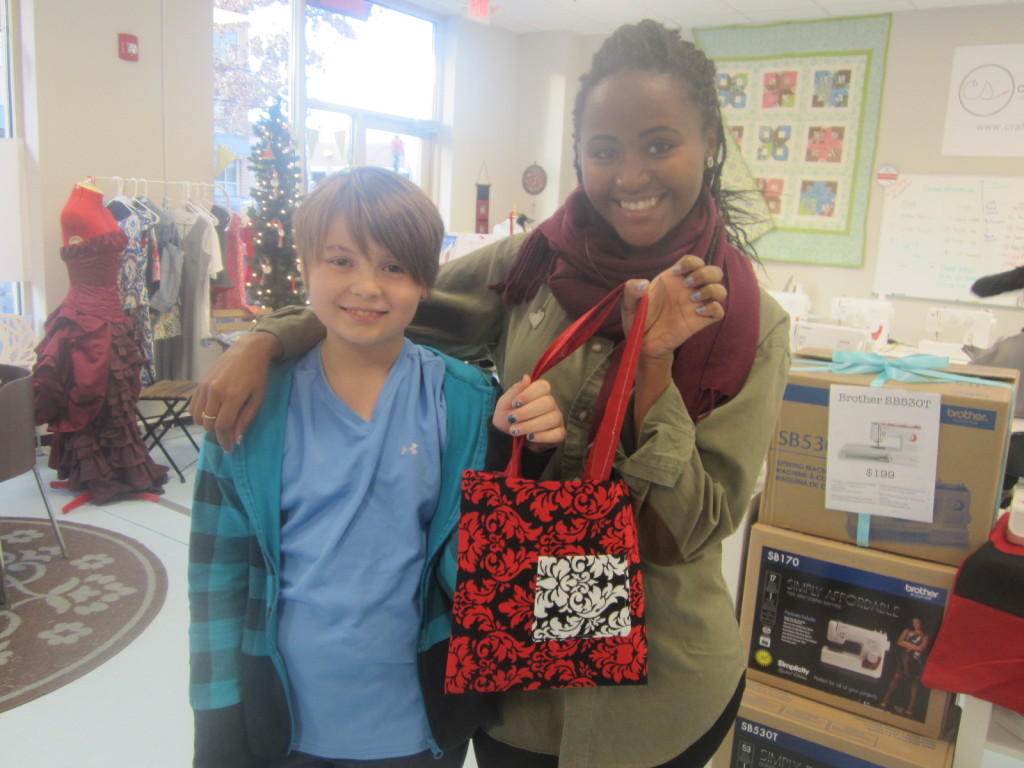 Nora & her teacher Margery at Craft Stitches with the bag she sewed
