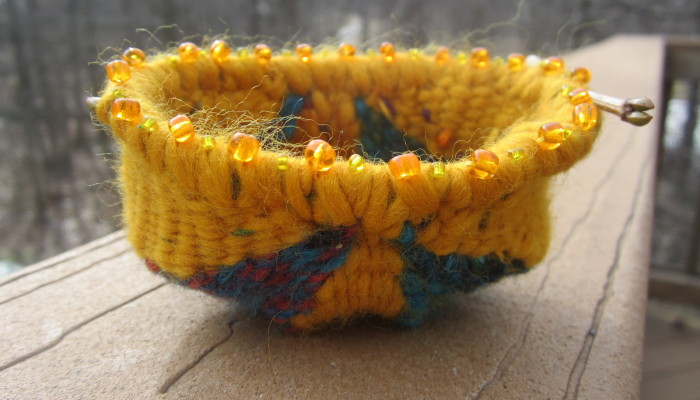 Woven receiving bowl - sun shines through beads