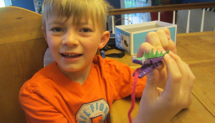 Russell with his clothespin lizard