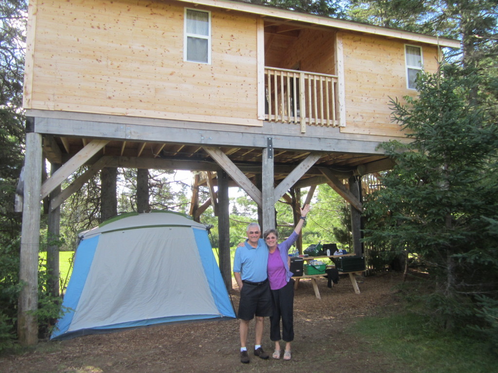 Mom & Dad in front of the treehouse