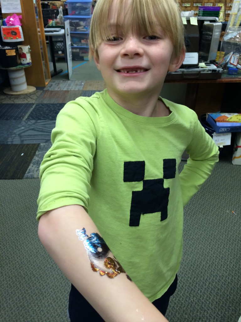 Very proud of his temporary tattoo at the Pittsburgh Center for Creative Reuse