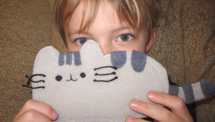 My son with his handmade Pusheen toy