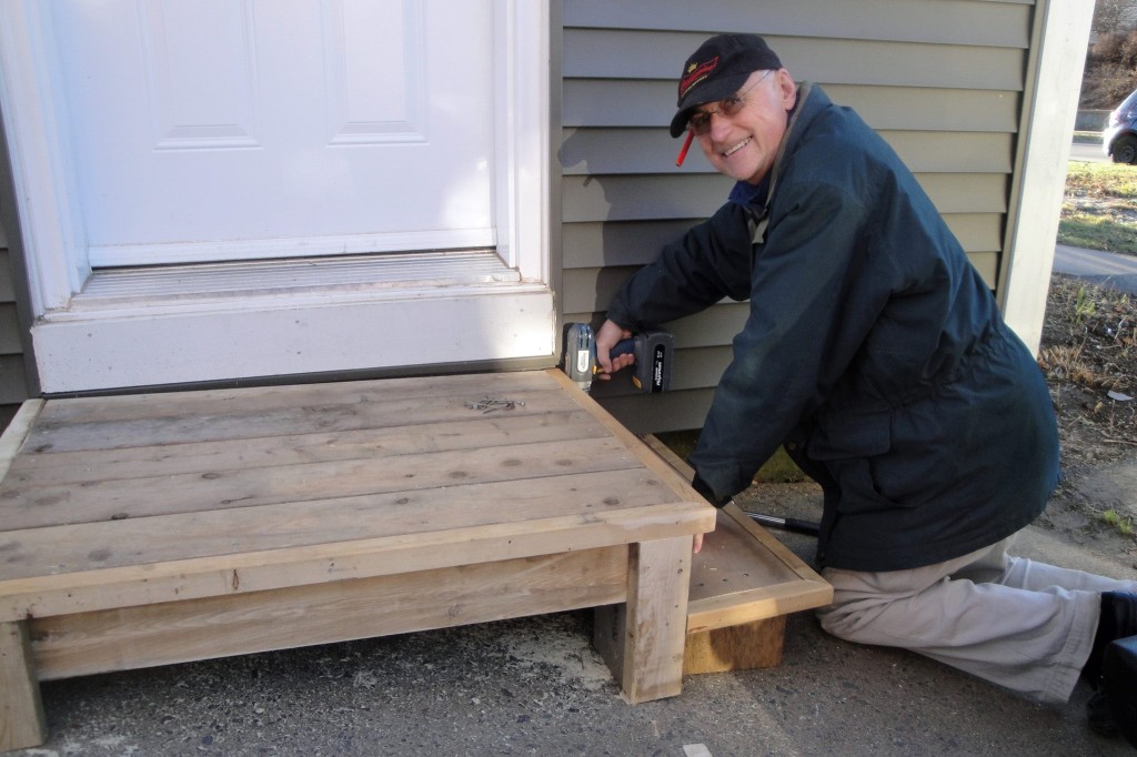 My dad building a step for my sister's house with scrap wood