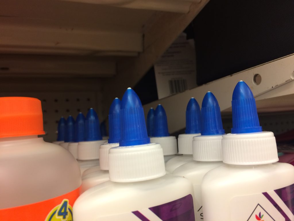 Blue and orange lids from glue bottles