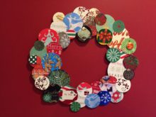 Wreath made from recycled holiday card circles pasted on cardboard circle by Trashmagination
