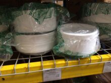 Polystyrene foam plates for sale on a shelf in a store