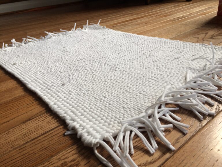 White rug woven from recycled t-shirts by Trashmagination