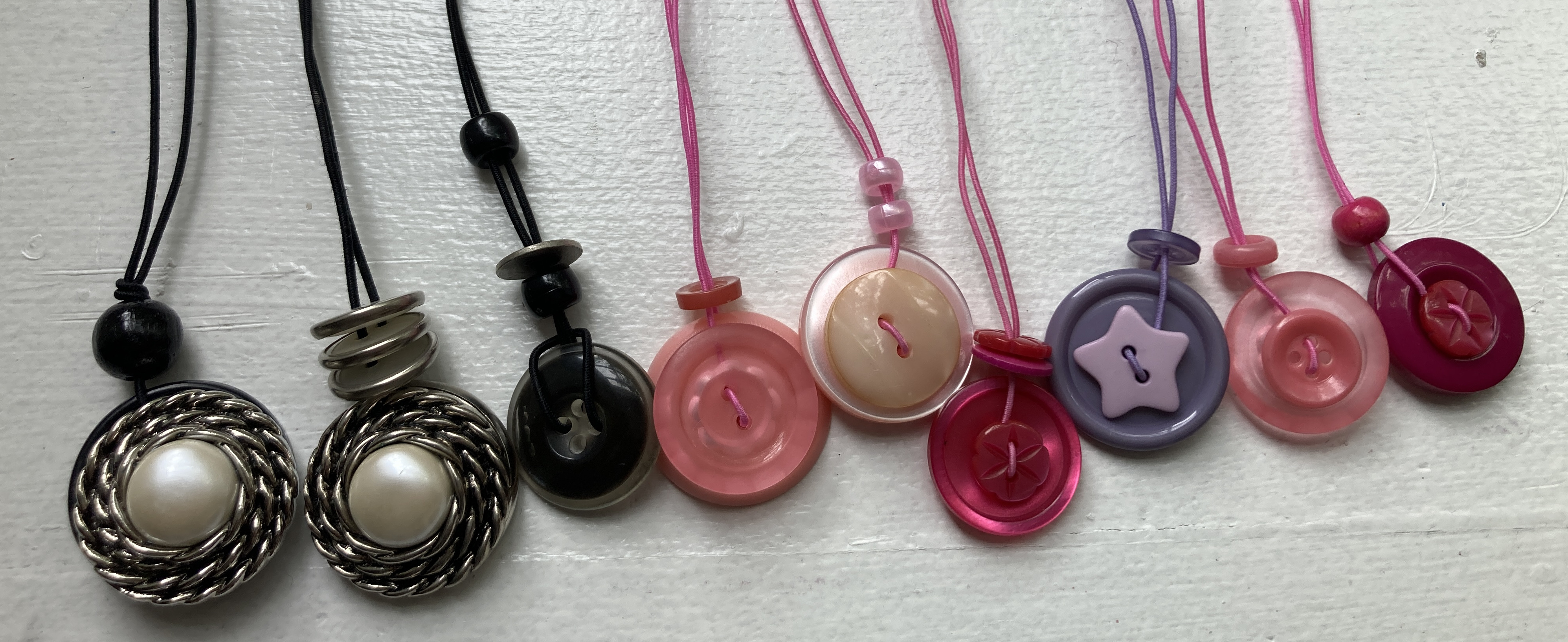 Examples of button necklaces designed by Gloria Brown